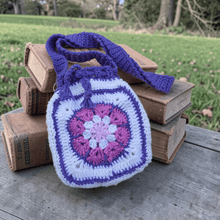 Load image into Gallery viewer, Granny Square Crochet Drawstring Bag – Handmade Boho Crochet Crossbody Purse in Pink, Purple &amp; White - Mariposa Rainbow Boutique
